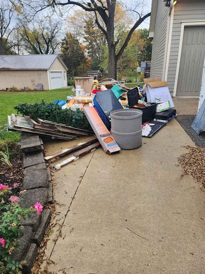 Dumpster being loaded with debris for 3 Yard Dumpster Rental in Town of Pecos